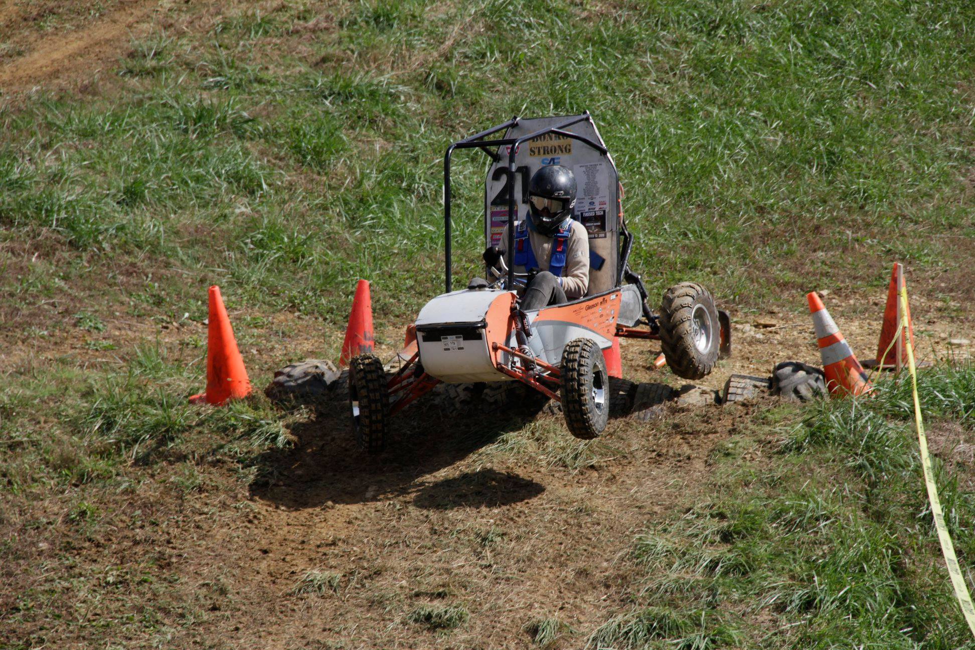 Image of the car driving over some tires.