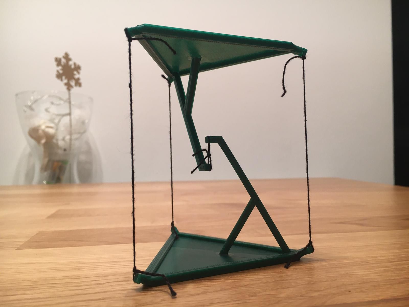 A 3D printed table that suspends itself with strings.